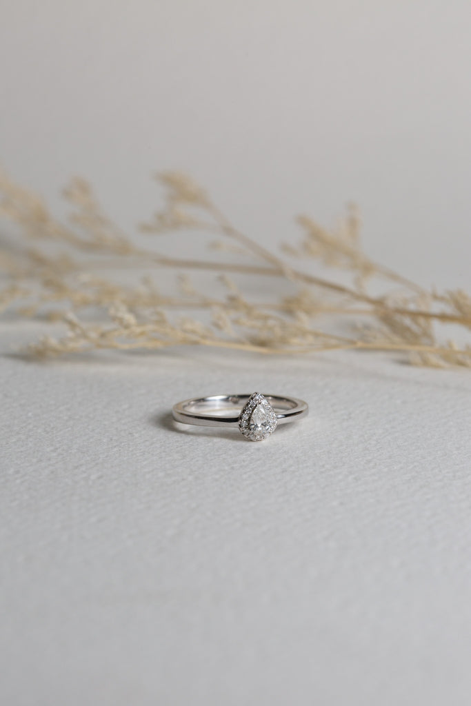White gold engagement ring, set with a pear-cut diamond