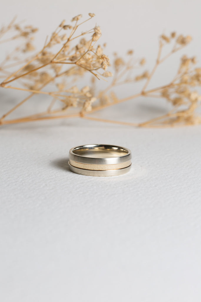 Mens white and yellow gold wedding ring