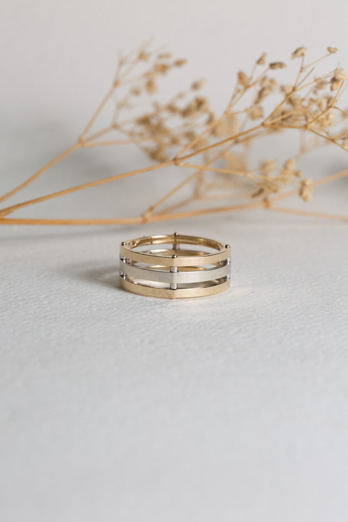 Mens modern white and yellow gold riveted wedding ring