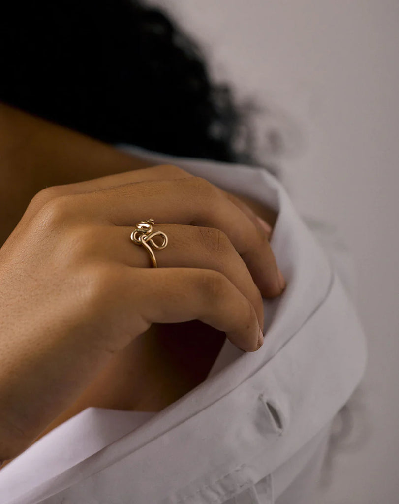 Meadowlark gold medusa ring shown on the finger