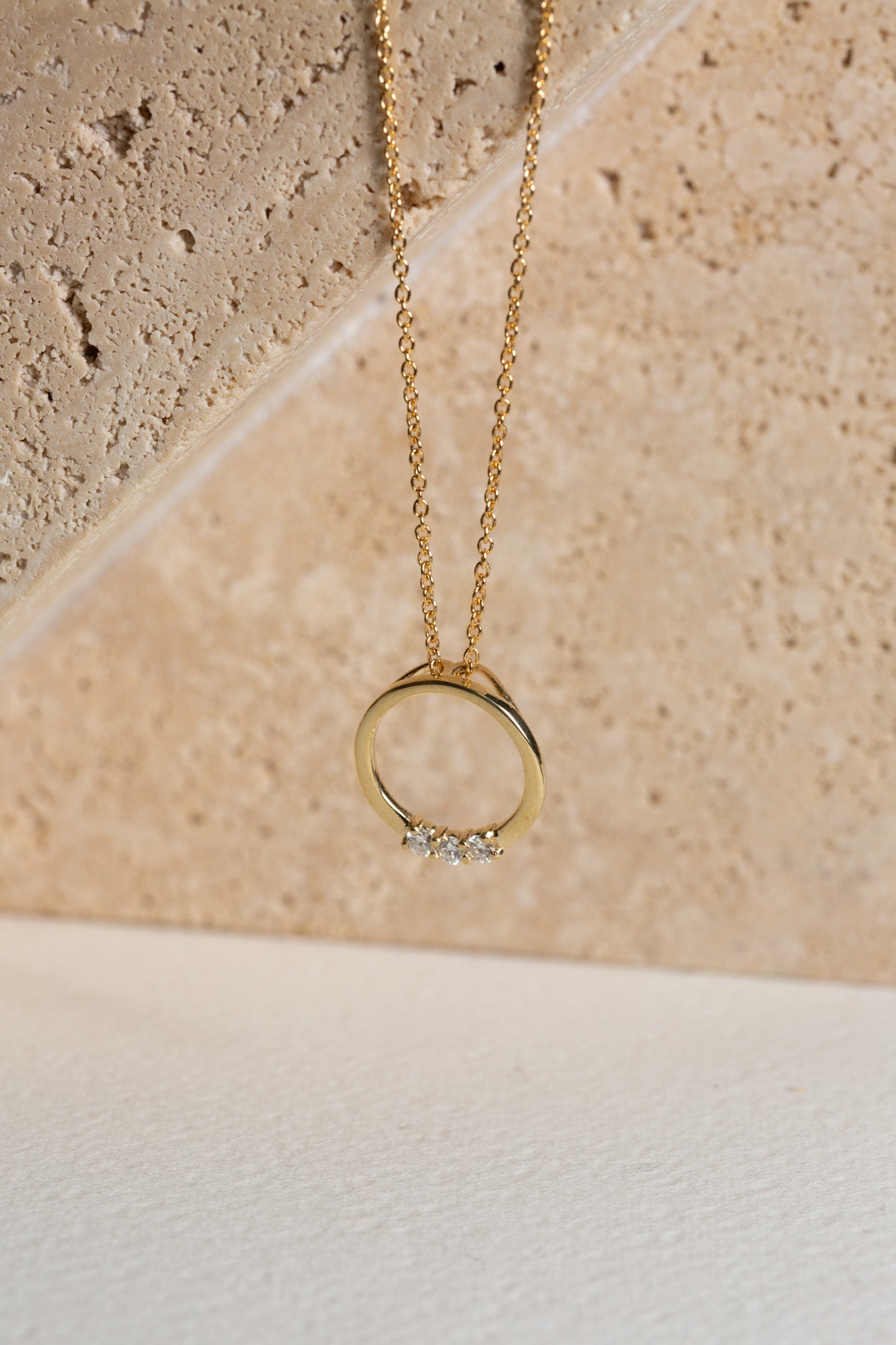 Gold circle family necklace set with three diamonds