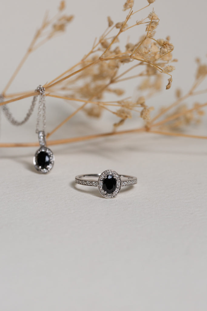 Matching white gold sapphire and diamond ring and pendant set