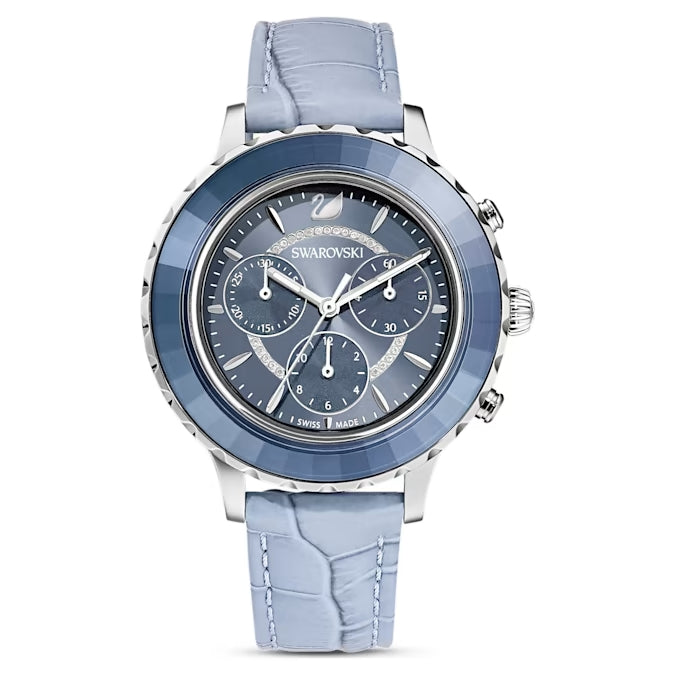 Swarovski Octea Lux chronograph watch.  The watch has a blue crystal bezel, blue dial, and a blue leather band.