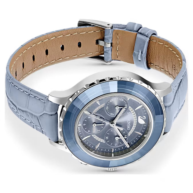Swarovski Octea Lux Chronograph watch.  The watch has a blue leather strap and a blue Swarovski crystal bezel.