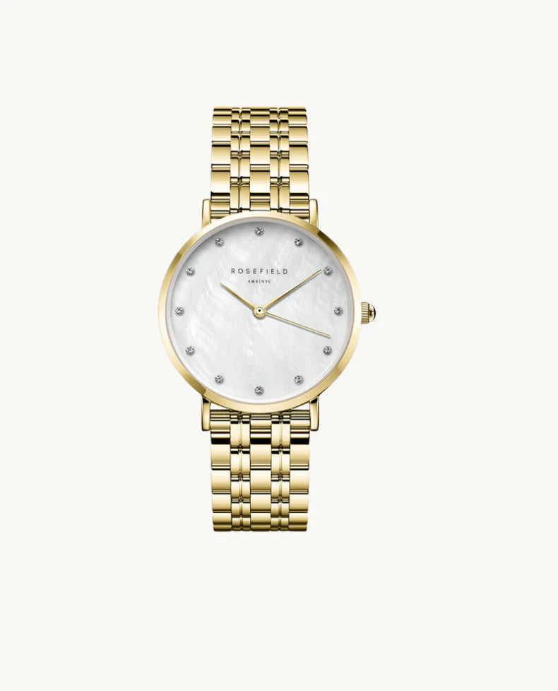 Ladies gold watch with pearl dial and crystal dial markers