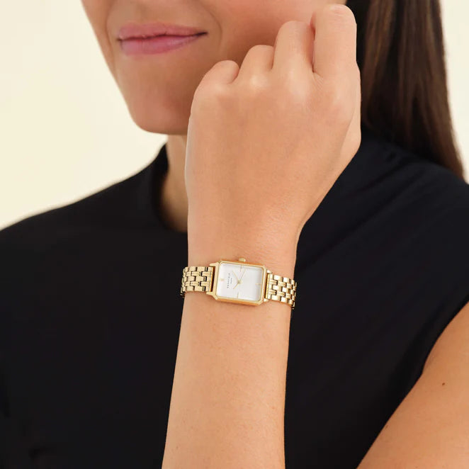 Model wearing a gold octagon watch