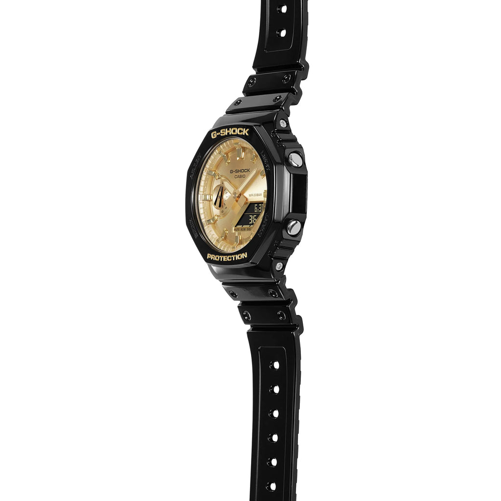 Black G Shock watch with a gold dial