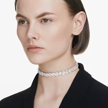A model is wearing the Swarovski Millenia Choker Necklace with a black outfit