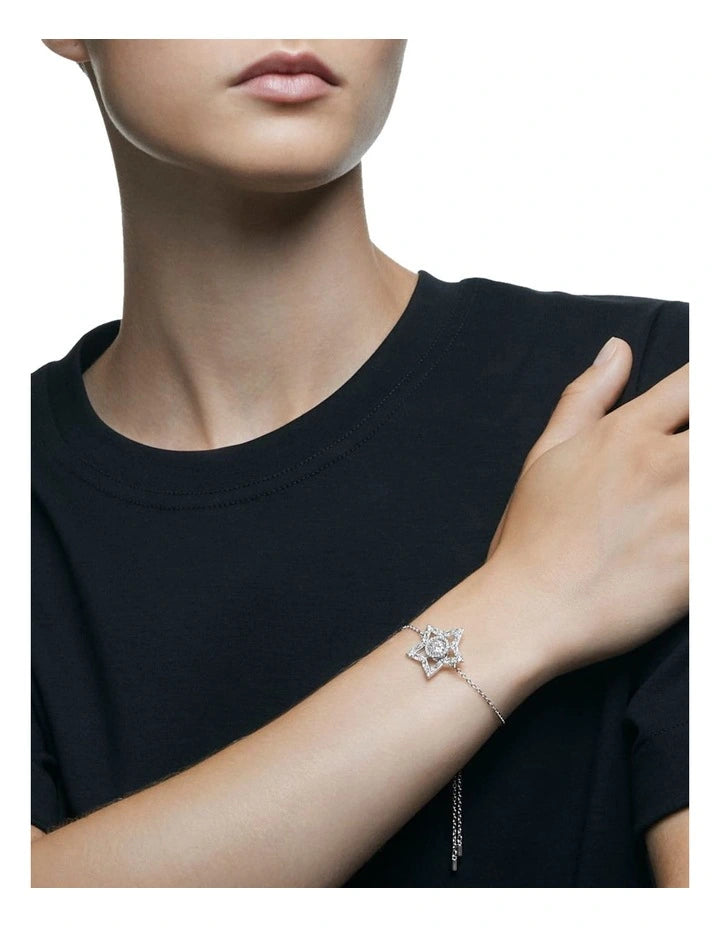 A model is wearing a star bracelet which is set with Swarovski crystals