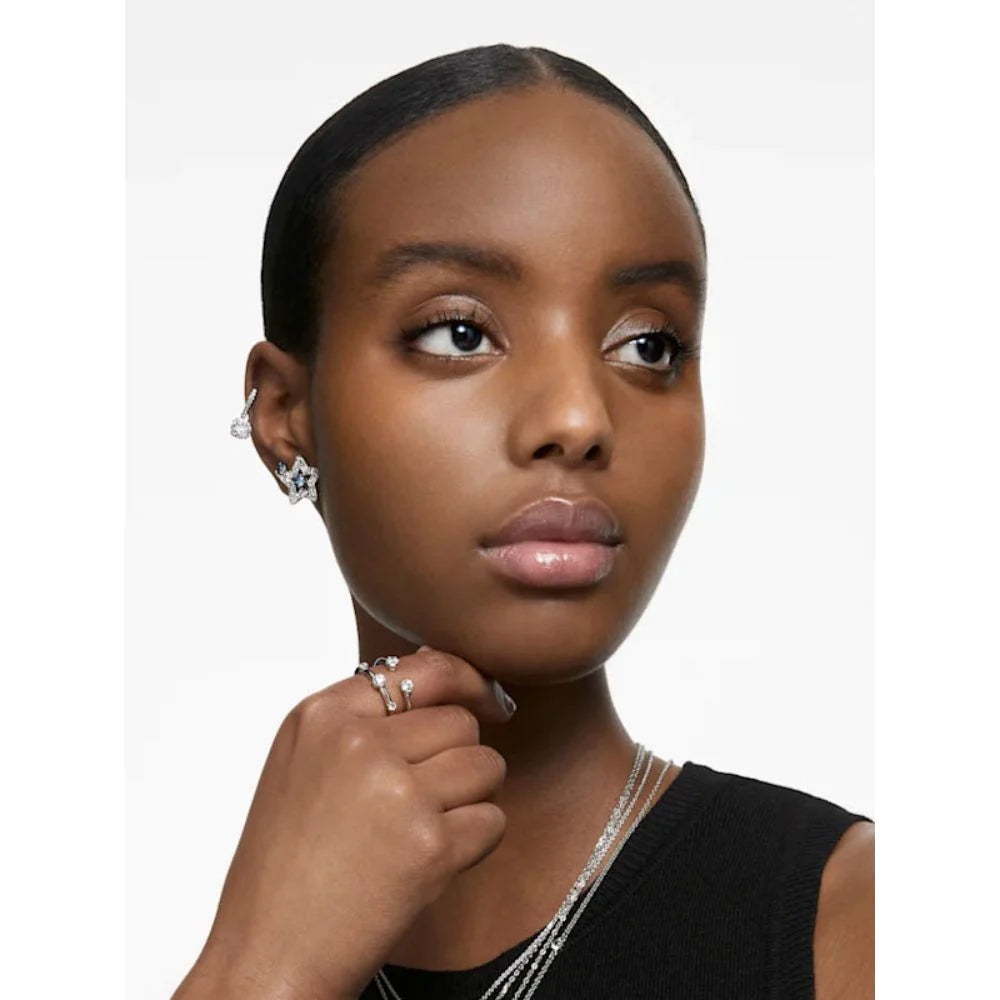 Swarovski star earrings, worn by a model