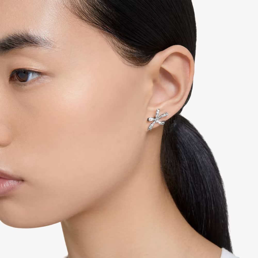 Swarovski bow stud earrings worn by a model