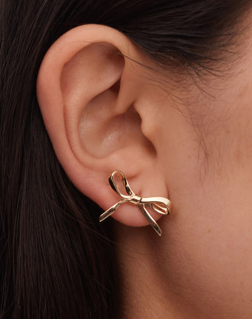 Gold oversized bow stud earrings