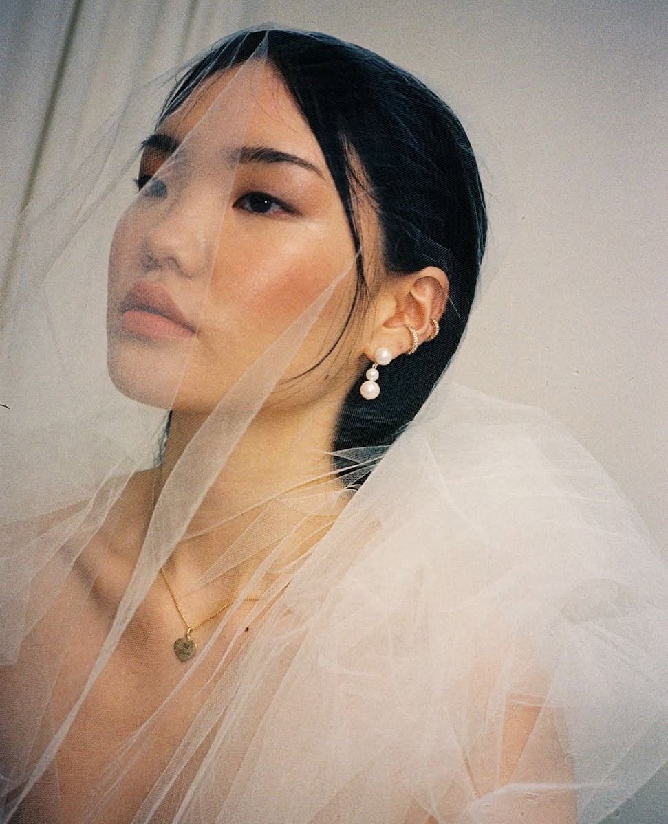 Meadowlark earrings and necklace worn by a model