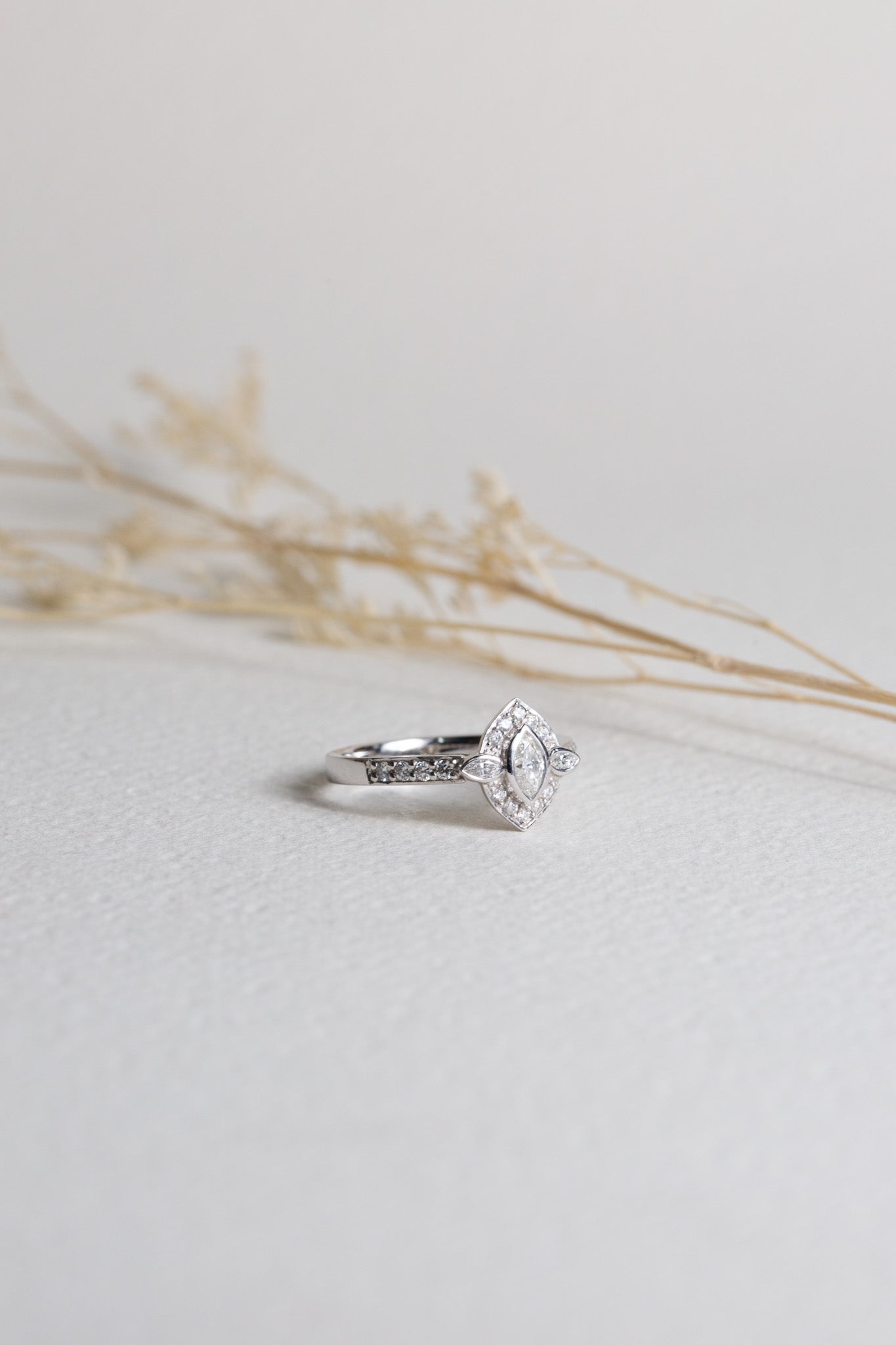 White gold dress ring set with a marquise-cut diamond in the centre