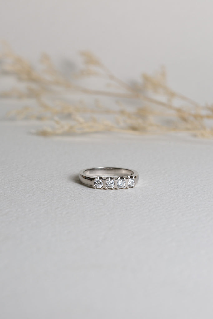 Platinum ring set with four diamonds