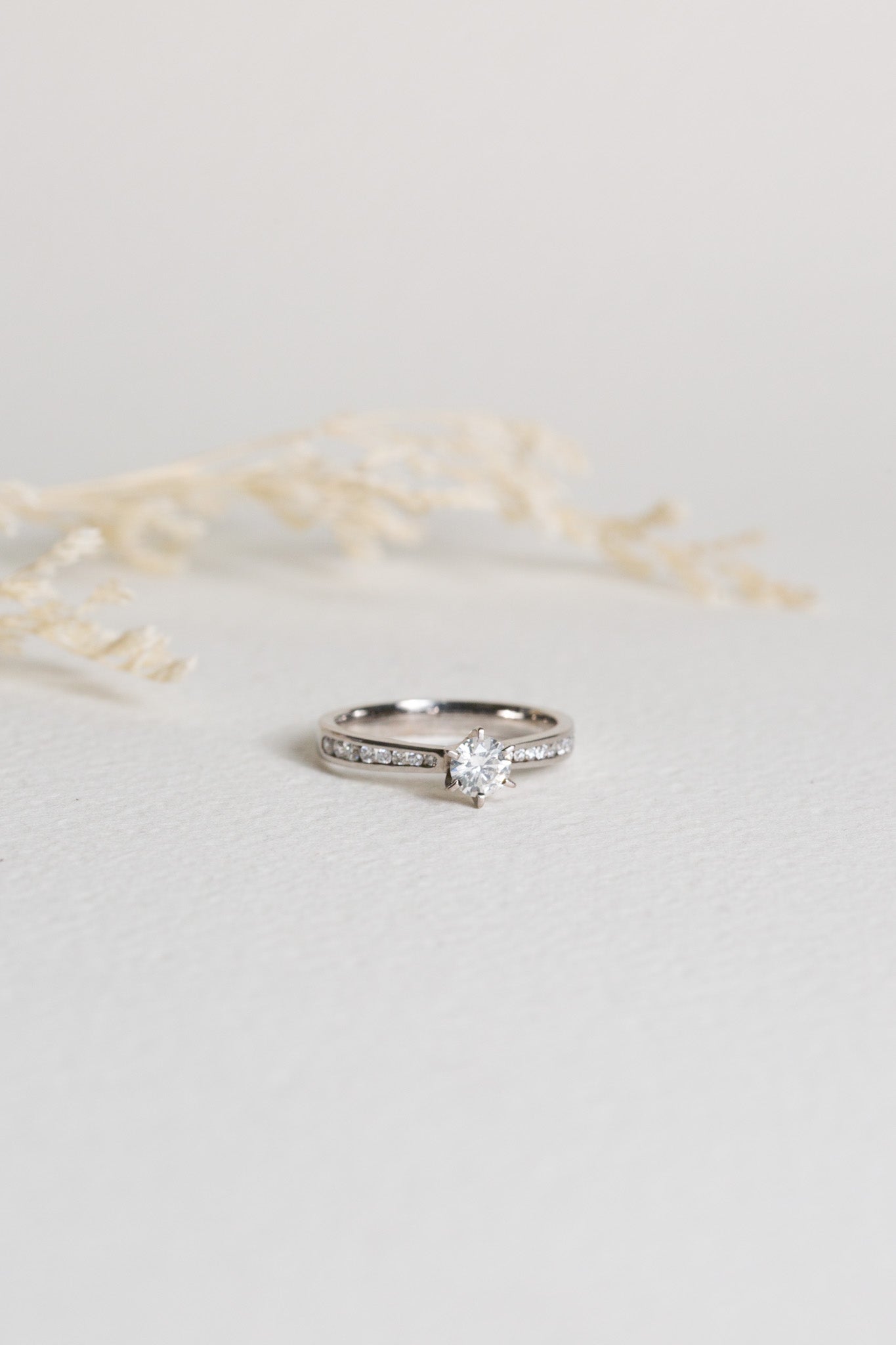 White gold diamond engagement ring with shoulder diamonds