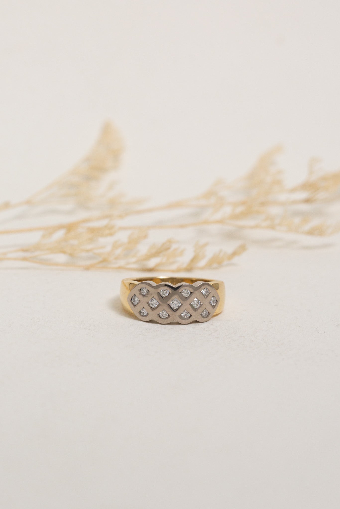 Gold and white gold diamond dress ring with a lattice design