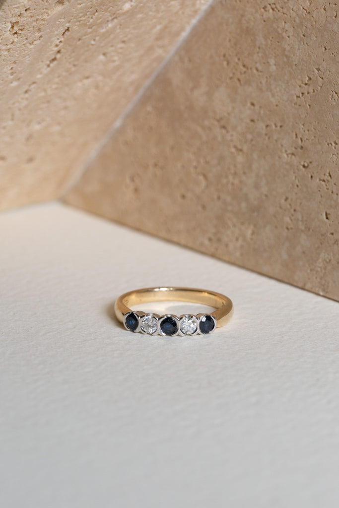 Sapphire and Diamond ring with rubover settings