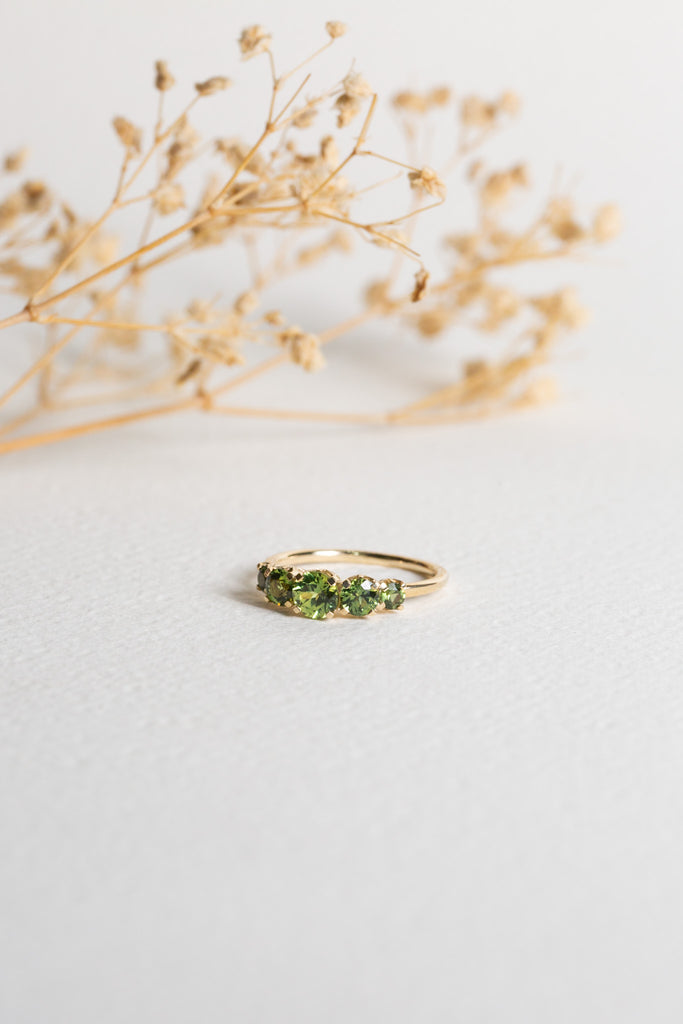5-stone ring with Green Sapphires