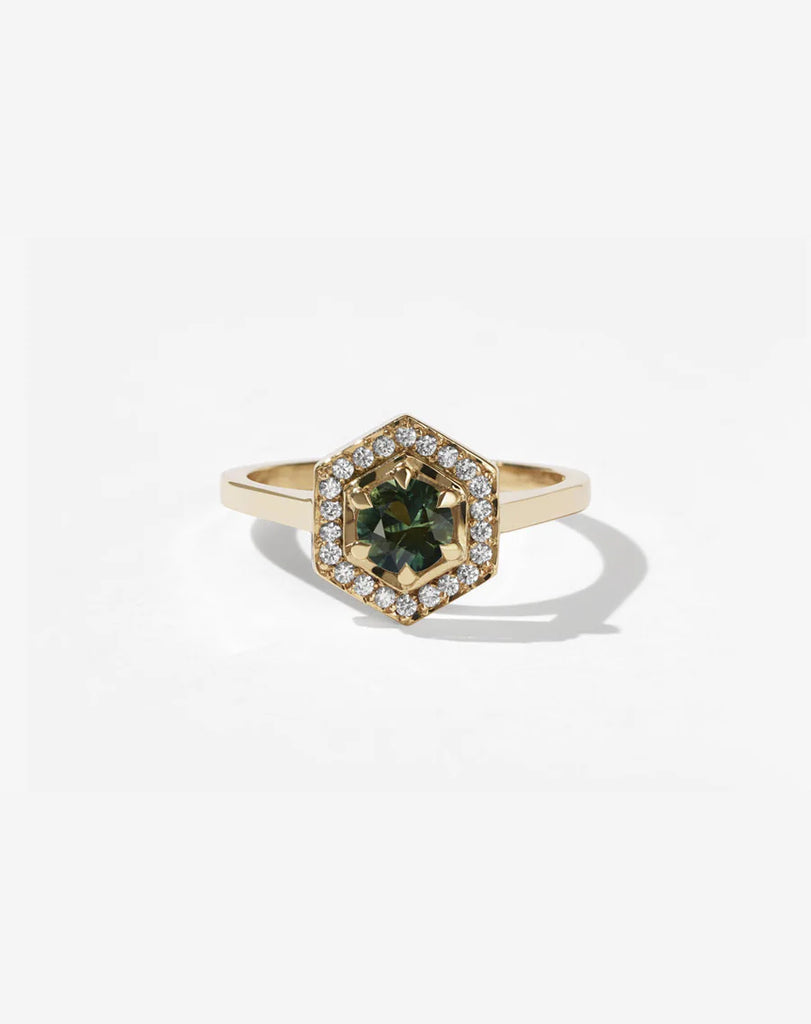 Gold engagement ring set with a Green Sapphire and diamonds