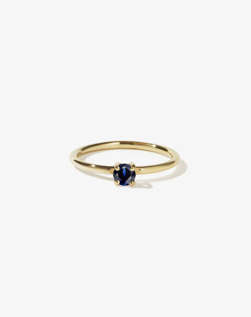 Dainty gold ring set with a single sapphire