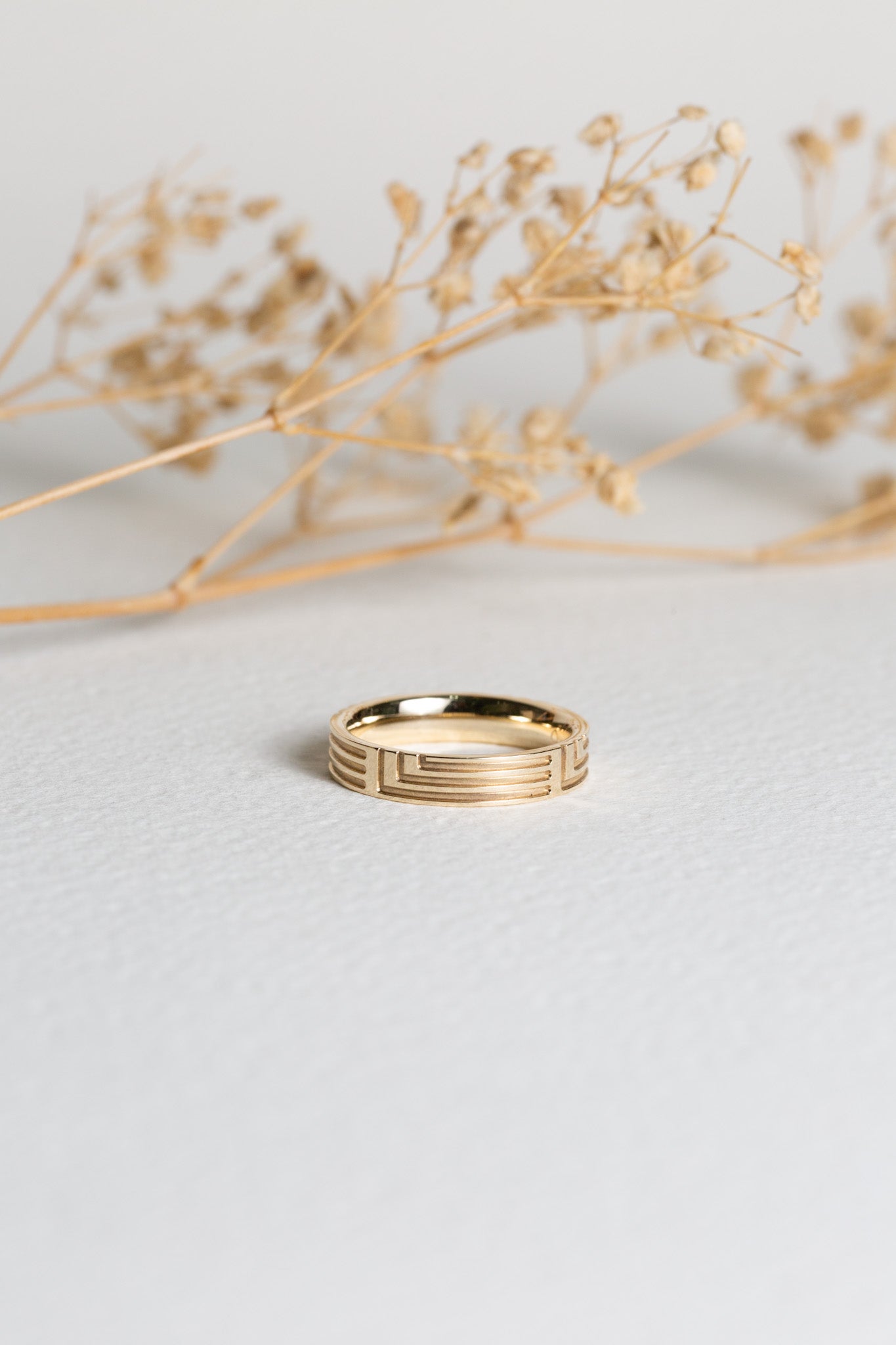 Ladies gold wedding ring with a geometric pattern