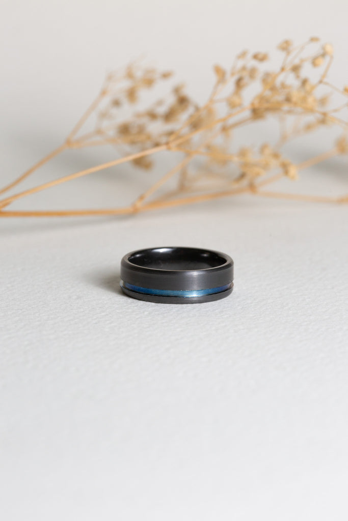 Gents black zirconium ring with a blue titanium stripe