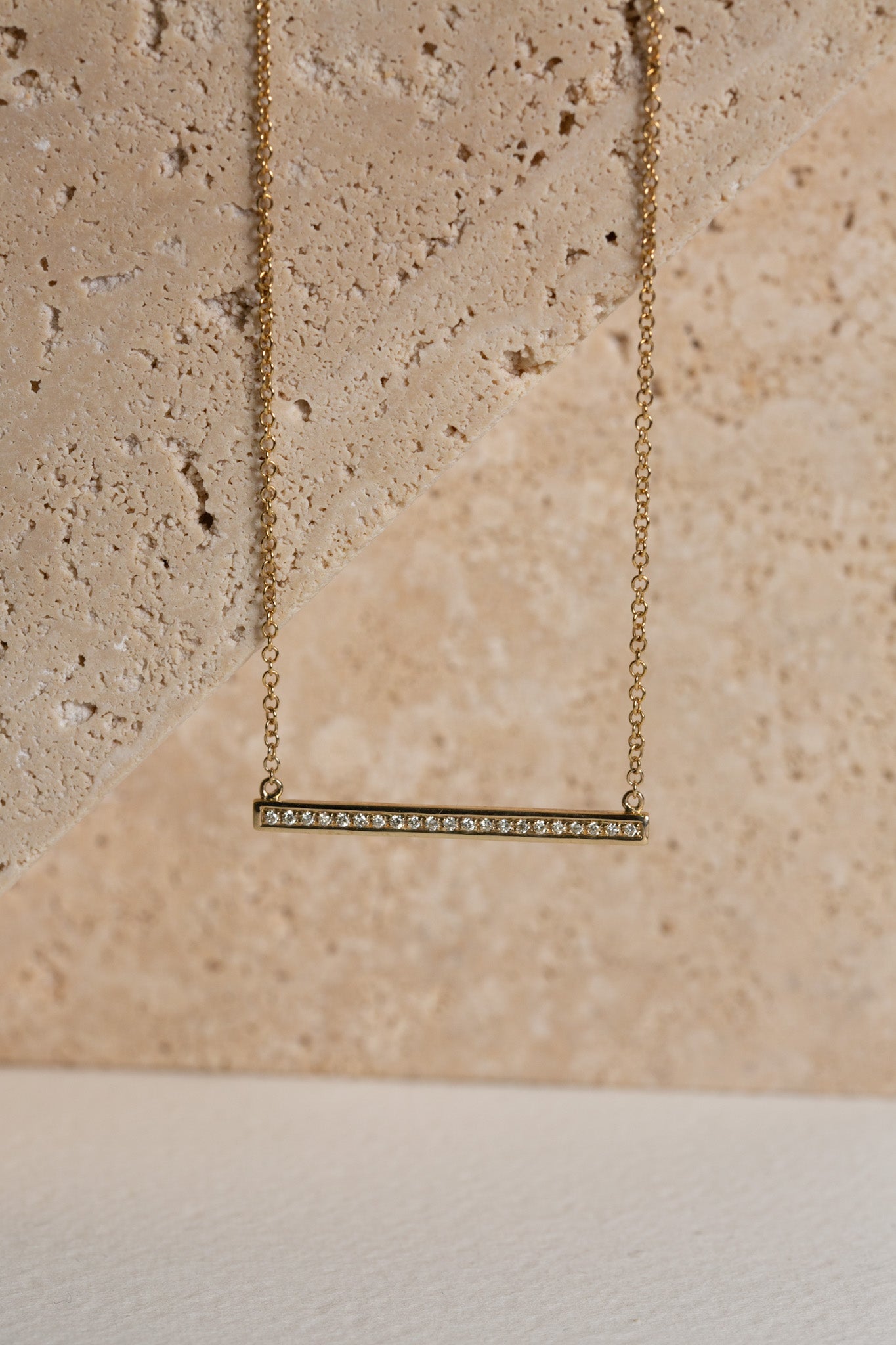 Diamond bar necklace in gold