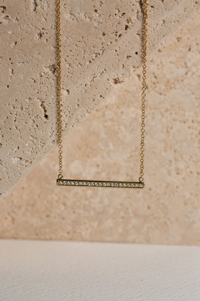 Diamond bar necklace in gold