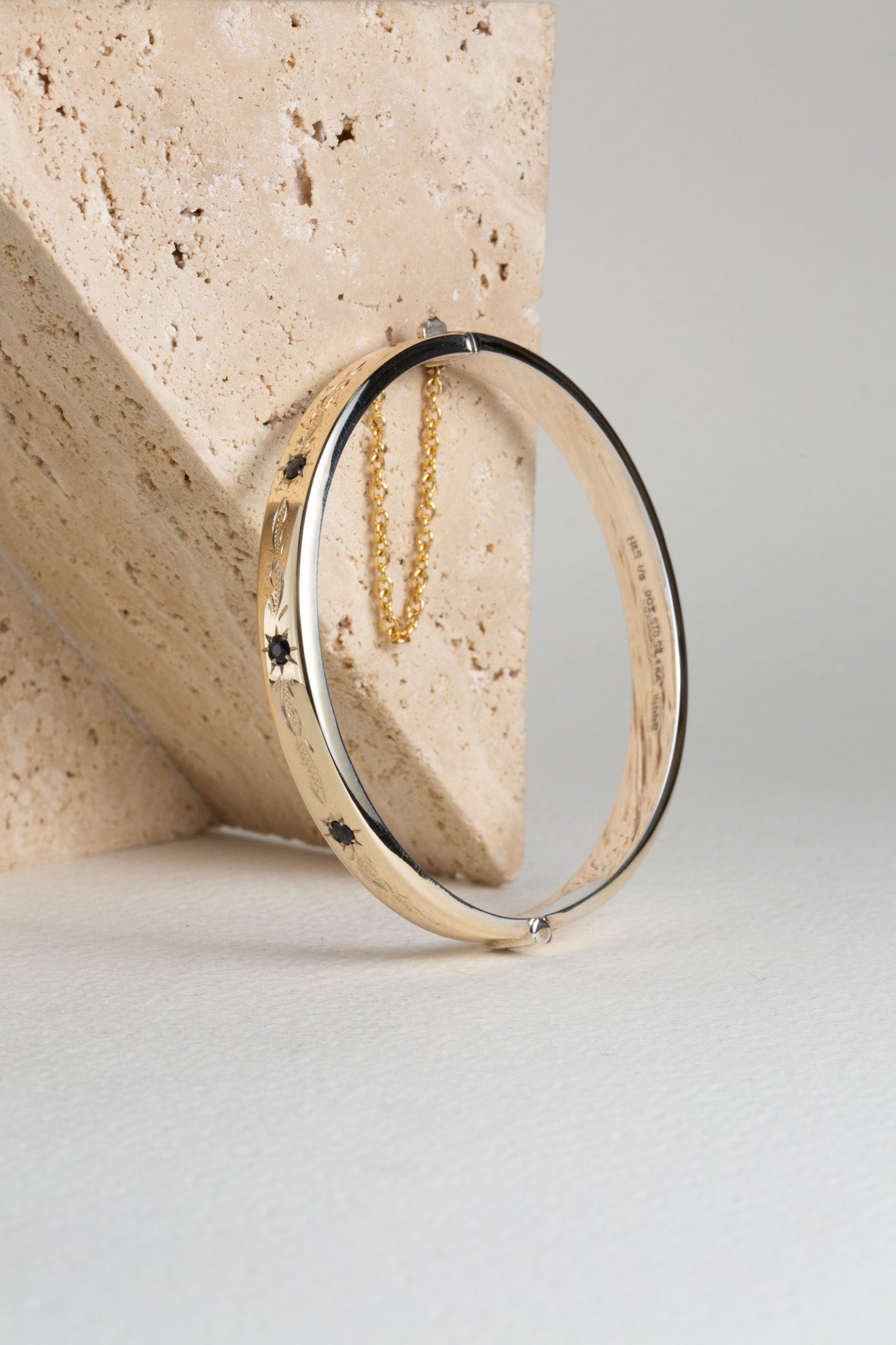 Gold and sapphire hinged bangle