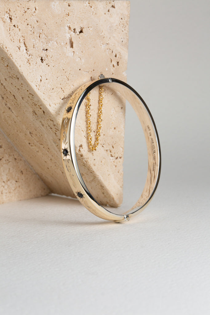 Gold and sapphire hinged bangle