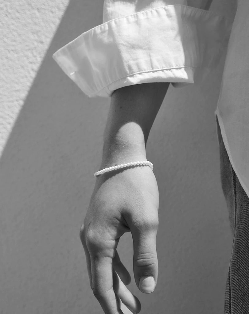 Model wearing a micro pearl bracelet