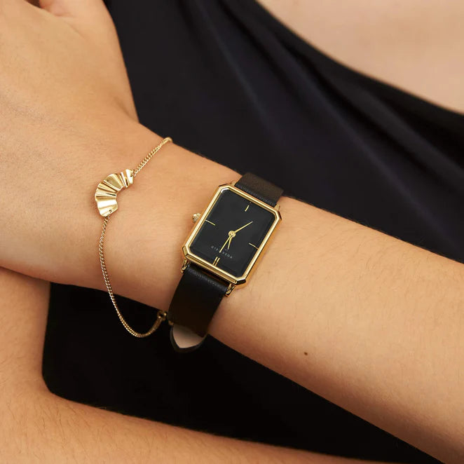 Ladies gold octagon watch with black dial and black leather strap