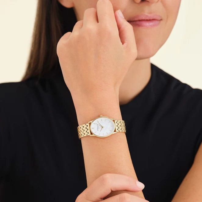 Model wearing a ladies gold oval watch

