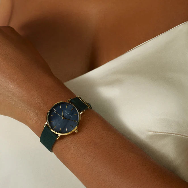 Ladies gold watch with black pearl dial and dark green leather strap