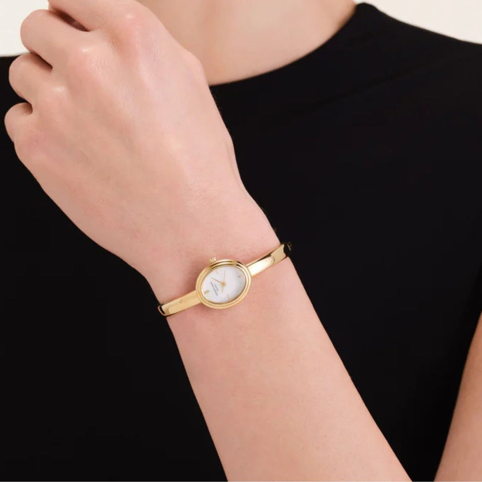 Rosefield Studio Edition Bangle Watch worn on wrist, gold-tone bangle style