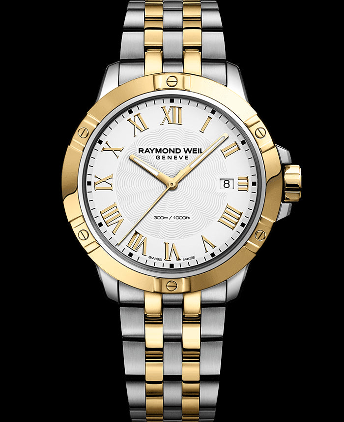Mens Raymond Weil Swiss watch with roman numerals.  The bracelet is gold and stainless steel.