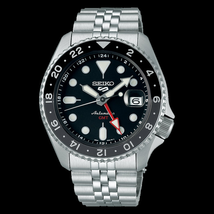 Seiko 5 Sports GMT watch with a black dial, black bezel, and stainless steel strap