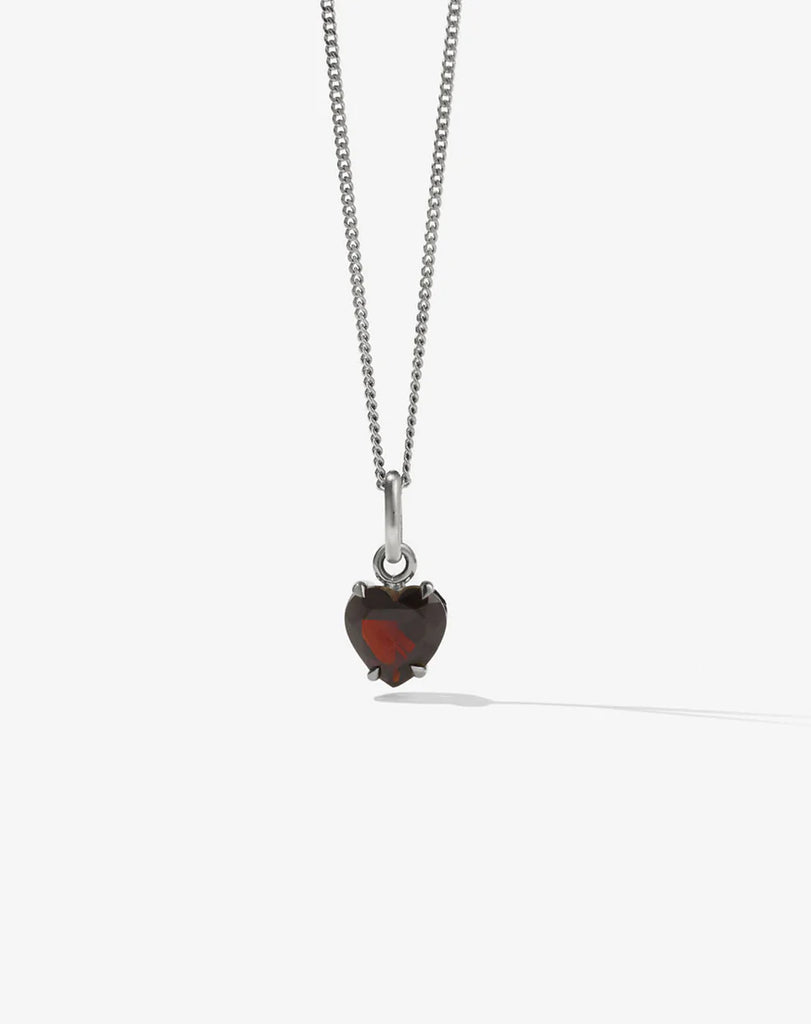 Silver necklace with a heart shaped garnet