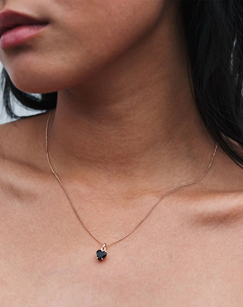Model wearing a heart necklace