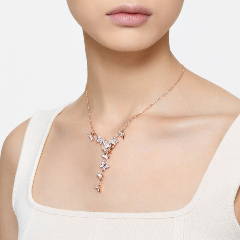 Rose gold butterfly necklace, worn by a model