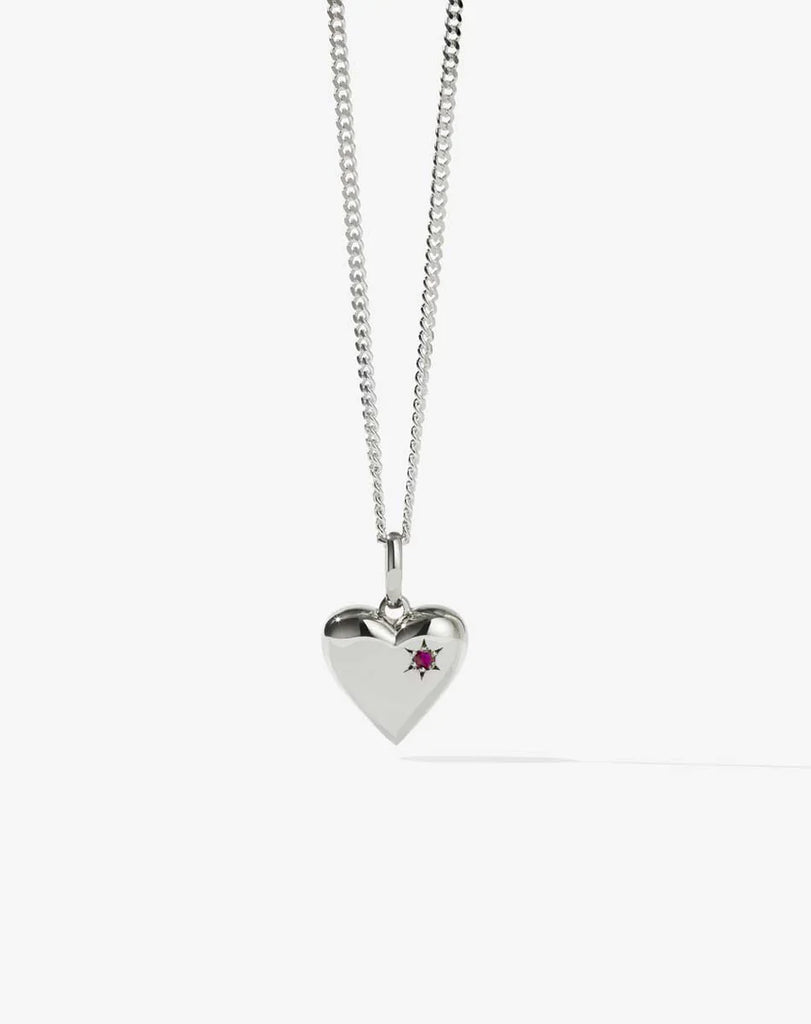 Silver heart necklace set with a single ruby