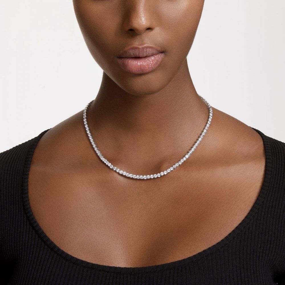 A model is wearing a timeless diamond tennis necklace