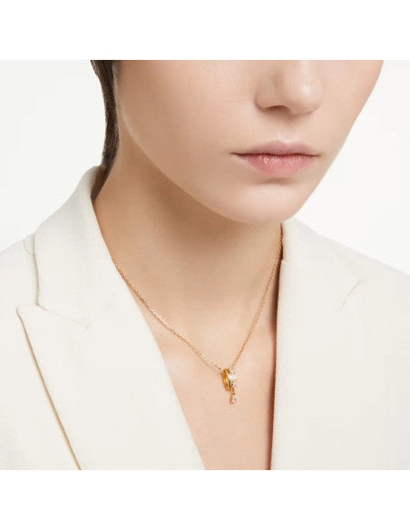 A model is wearing the Swarovski Dextera Pendant