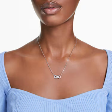 Infinity sign necklace, worn by a model