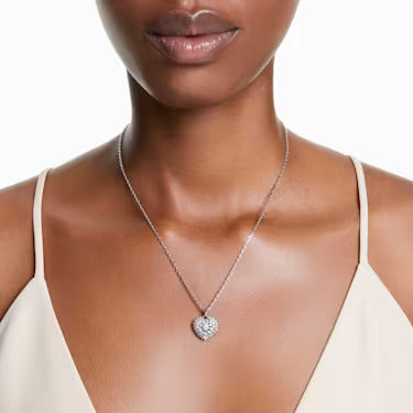 Model wearing a silver heart necklace