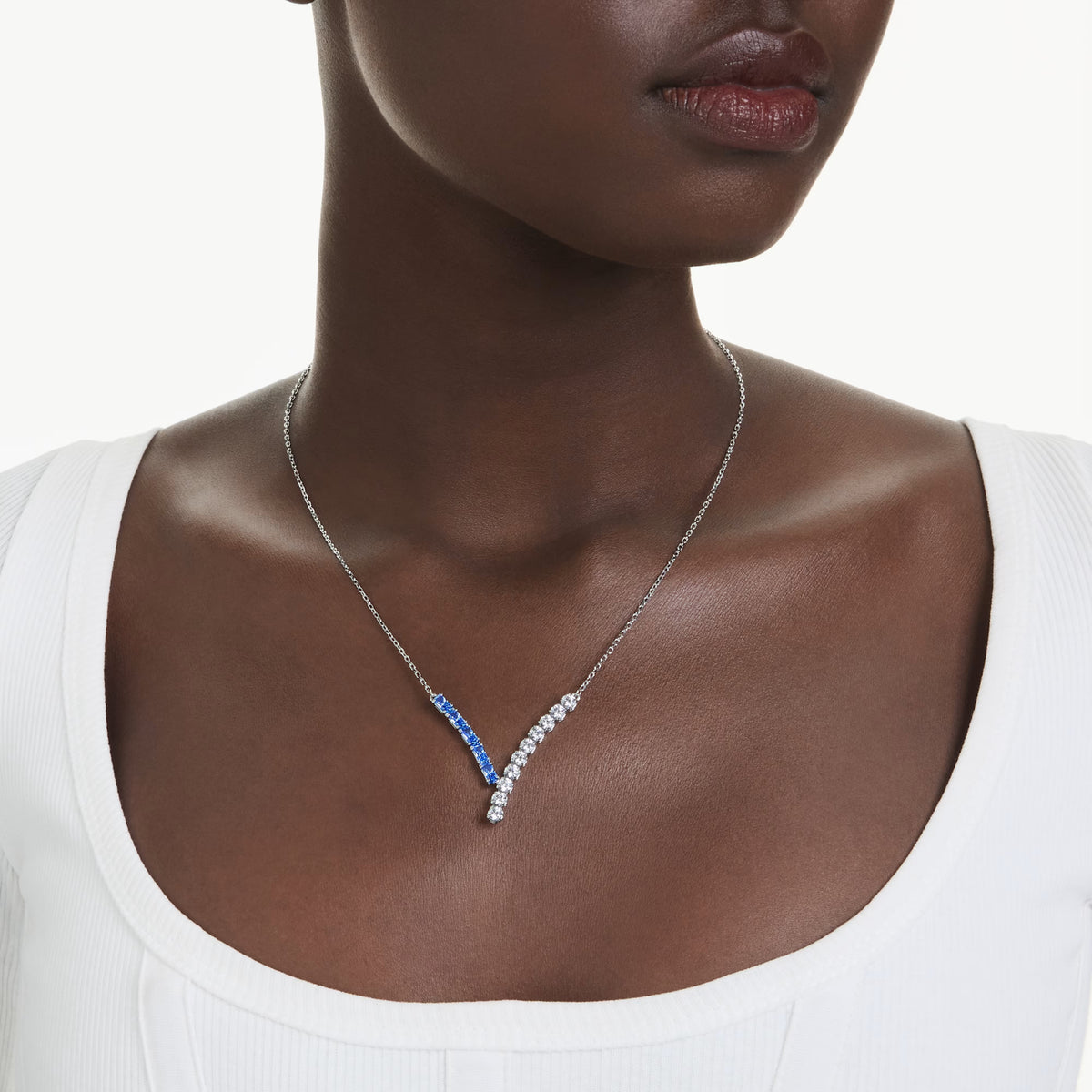 Swarovski Matrix pendant, rhodium-plated V-shape design with clear and blue crystals
