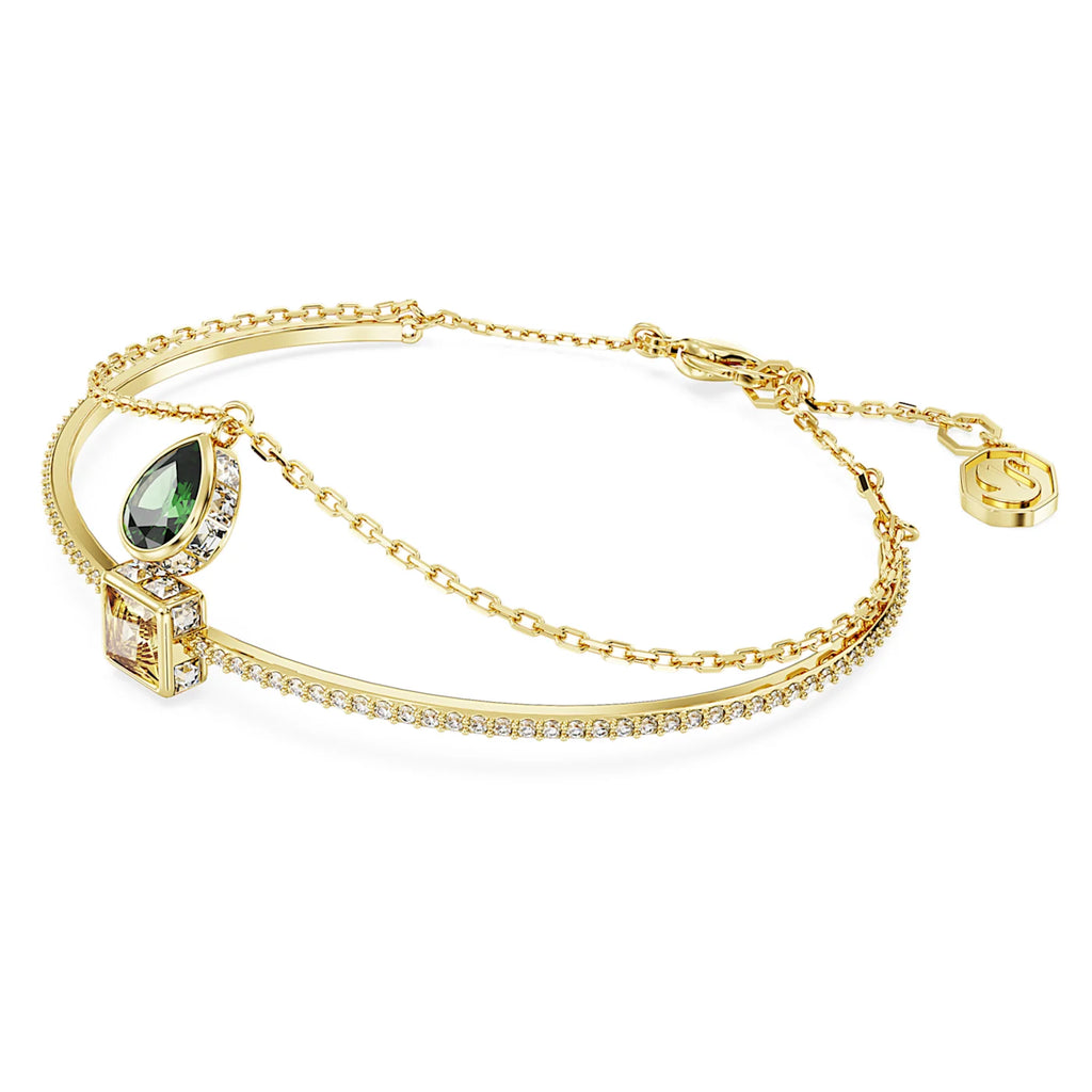 Swarovski Stilla Bangle with a green pear shaped crystal
