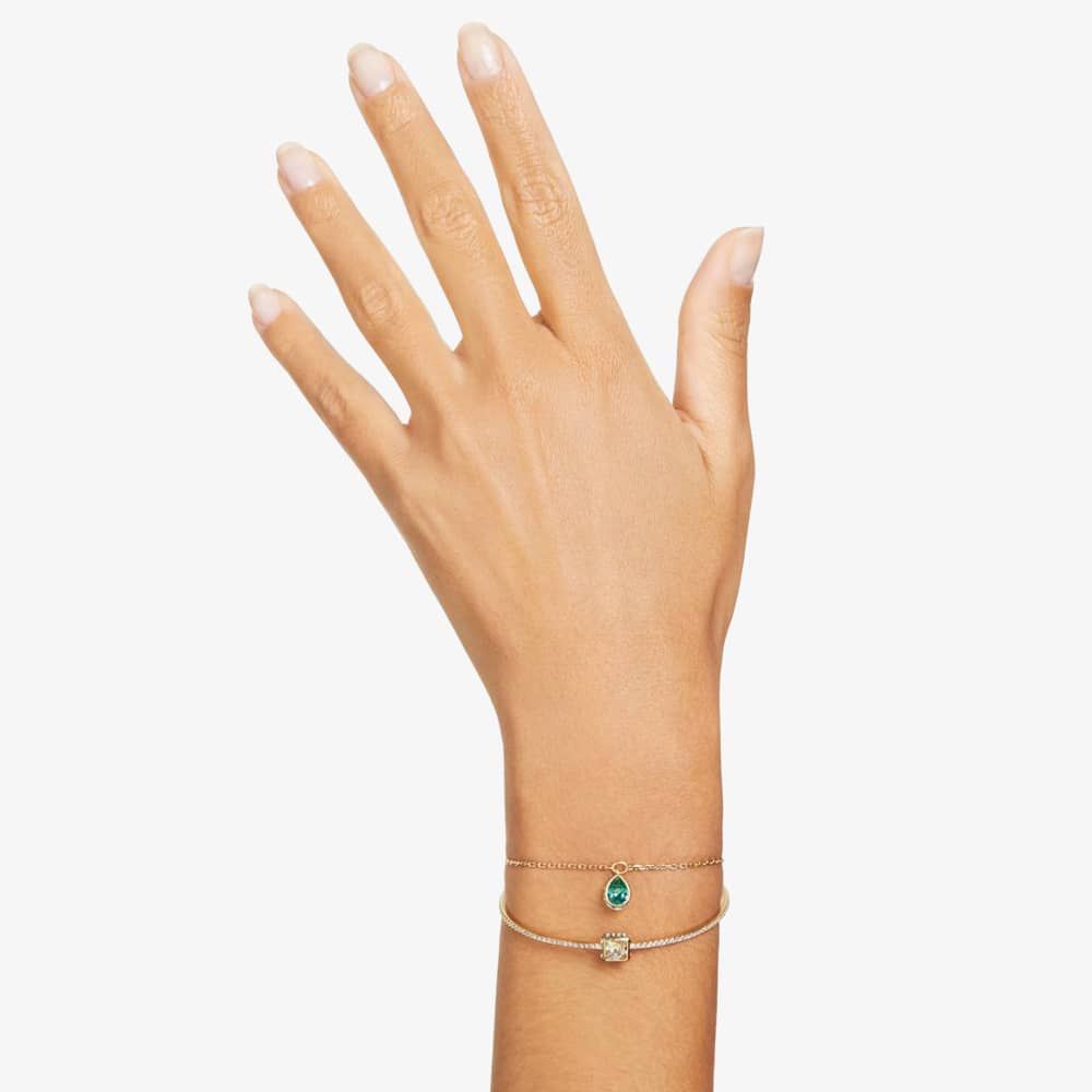A model is wearing the double-strand Swarovski Stilla Bangle