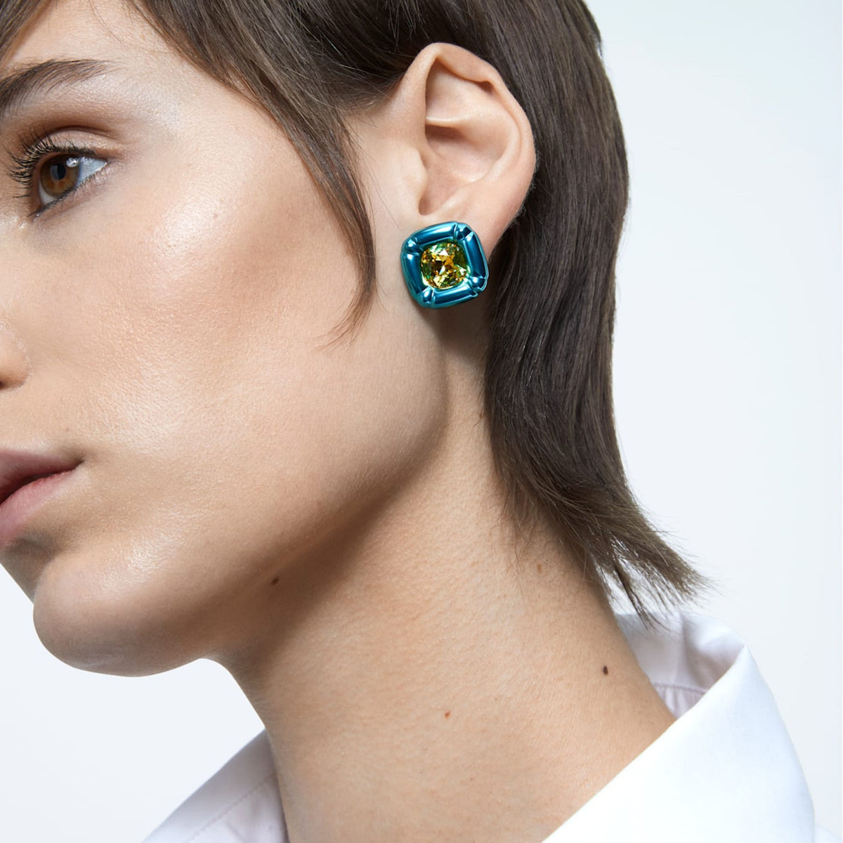 Swarovski Dulcis stud earrings, yellow cushion-cut crystal in rounded blue setting